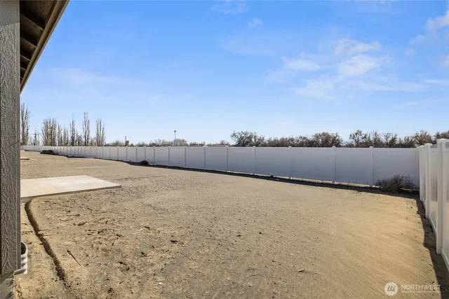a view of swimming pool with a yard