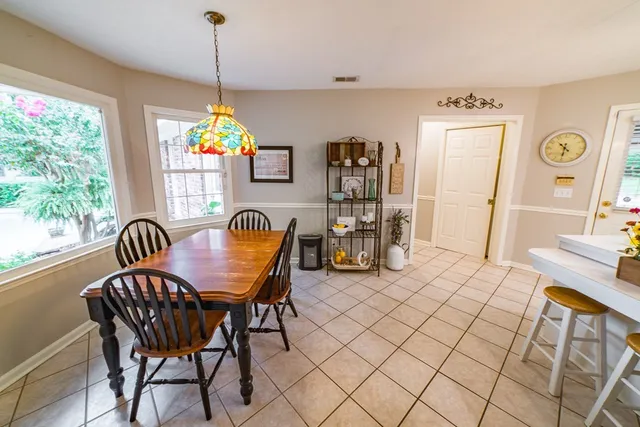 a view of a livingroom with furniture window and wooden floor