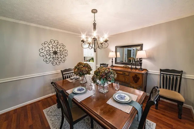 a bedroom with furniture and a wooden floor