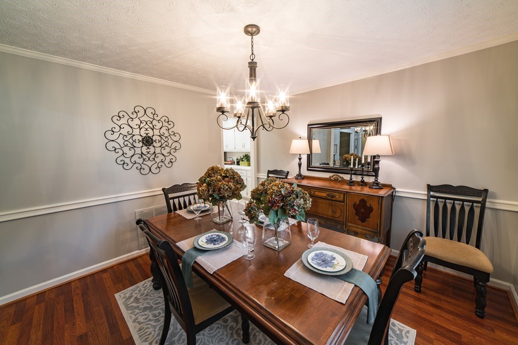 9 Conisburgh Court Columbus, GA 31907 - Photo 28 of 46 a view of a dining room with furniture and wooden floor