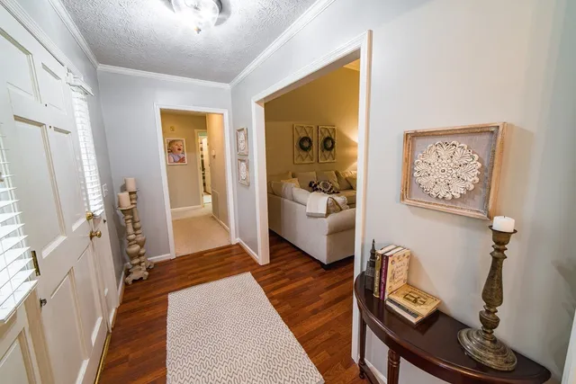 a living room with furniture a ceiling fan and a window