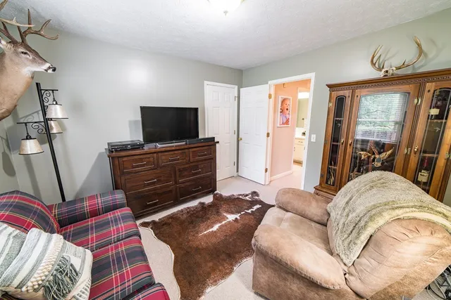 a view of a hallway with paintings on the wall