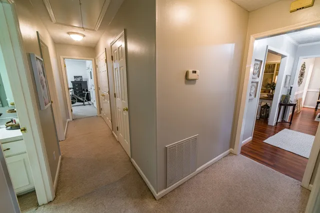 a spacious bathroom with double vanity and a mirror