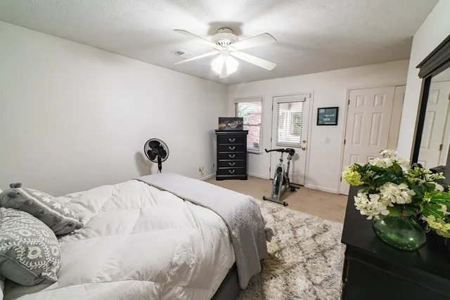 a room with a dresser and a window