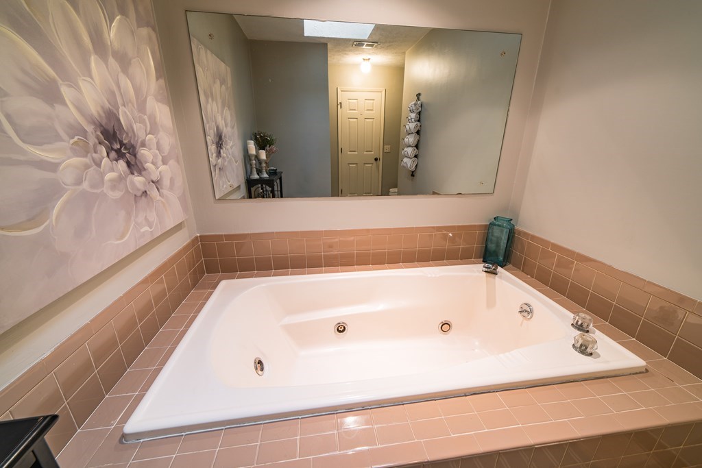 9 Conisburgh Court Columbus, GA 31907 - Photo 44 of 46 a bathroom with a bathtub and a shower