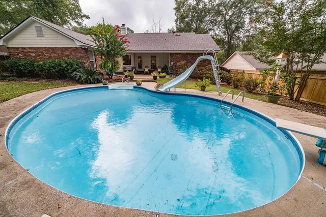 a view of a house with swimming pool