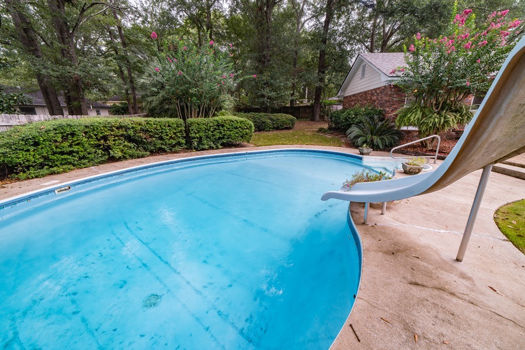 9 Conisburgh Court Columbus, GA 31907 - Photo 7 of 46 a view of a swimming pool with a yard and plants