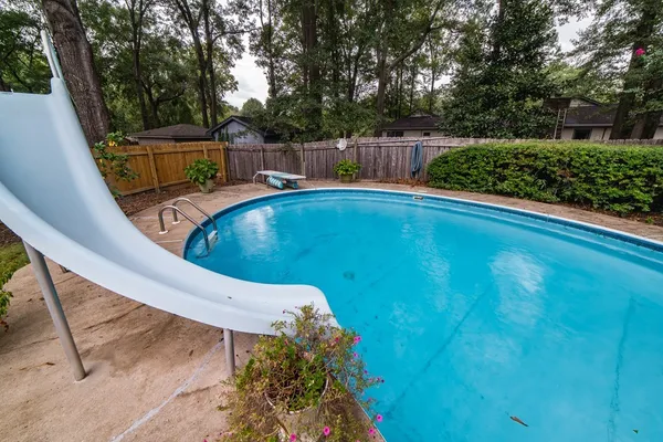a view of a swimming pool with a patio