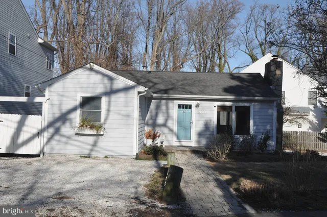 a view of a house with a snow in the yard