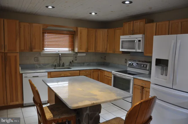 a house that has a tree in front of it