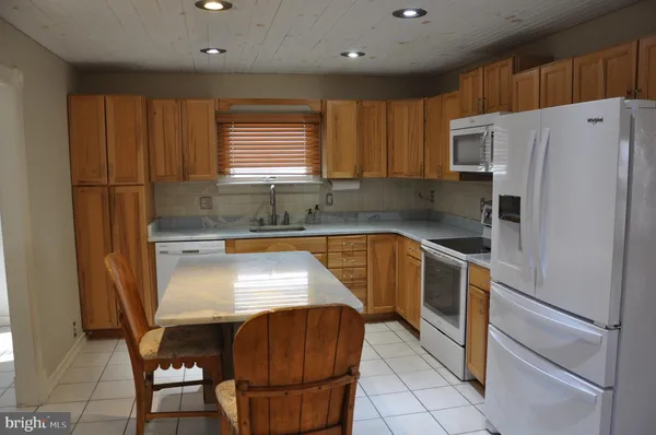 a view of a lake with a house in the background