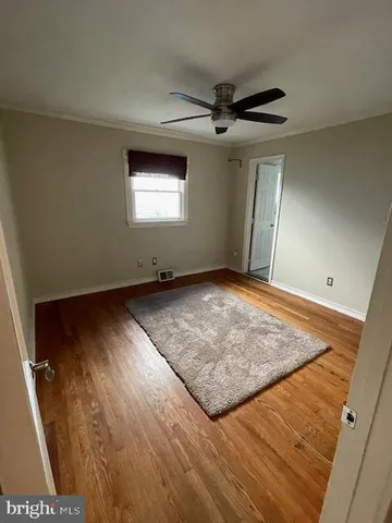 a house that has a tree in front of it