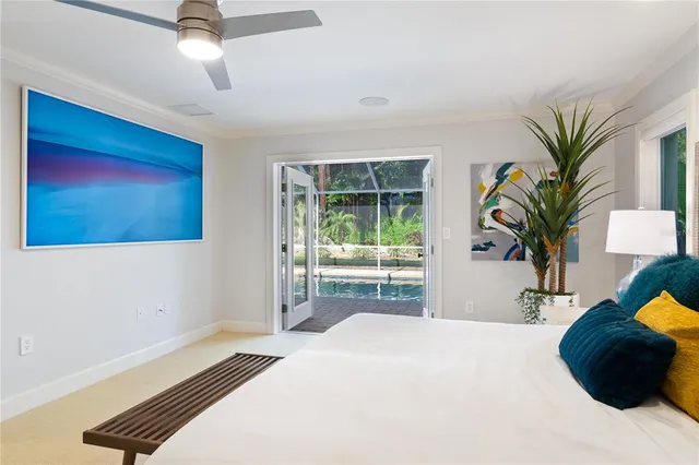 a bedroom with a bed and a potted plant