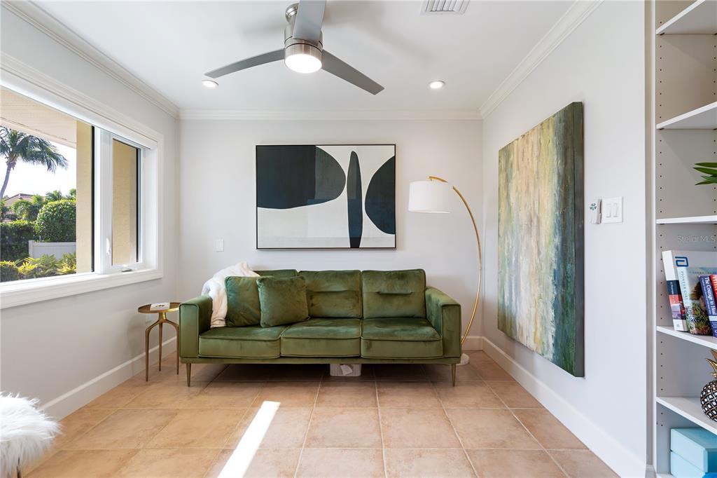 606 Owl Way Sarasota, FL 34236 - Photo 22 of 35 a living room with furniture bathtub and a window