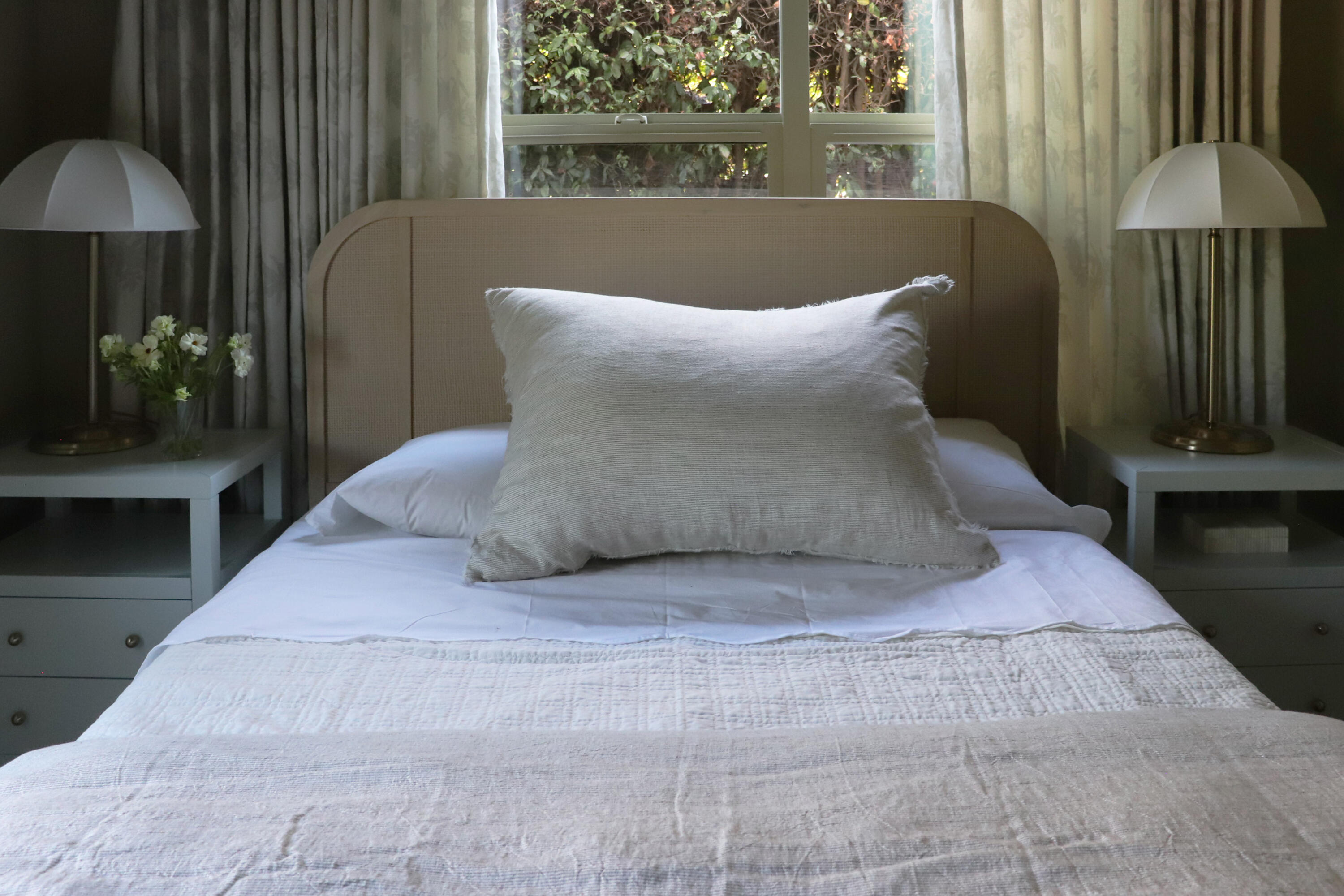 1111 East Ortega Street Santa Barbara, CA 93103 - Photo 12 of 17 a large bed sitting in a bedroom next to a window