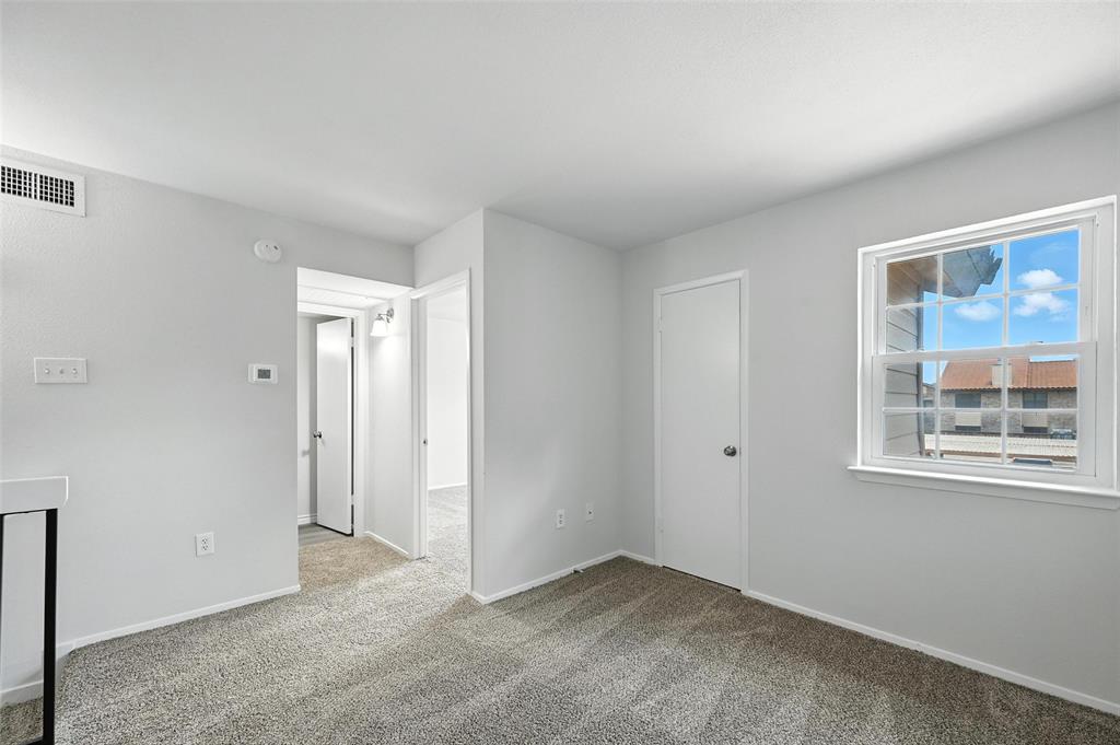 5626 Preston Oaks Road, Unit 22C Dallas, TX 75254 - Photo 19 of 29 a view of an empty room with a window