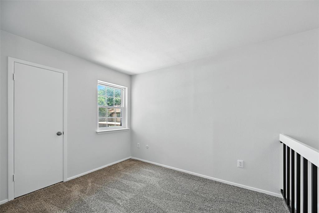 5626 Preston Oaks Road, Unit 22C Dallas, TX 75254 - Photo 22 of 29 an empty room with windows