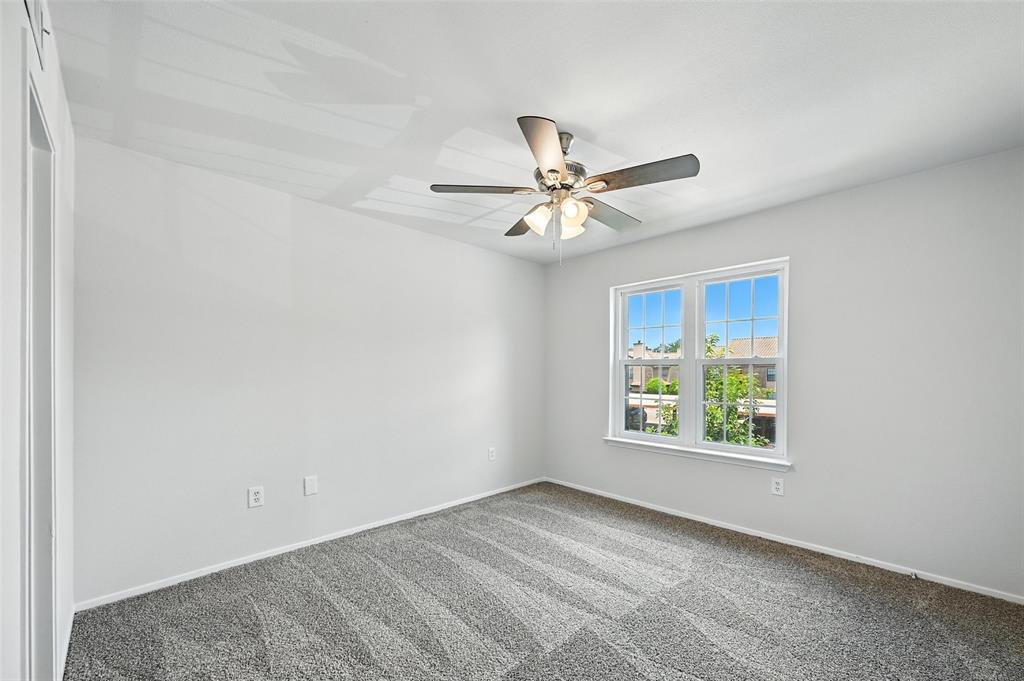 5626 Preston Oaks Road, Unit 22C Dallas, TX 75254 - Photo 24 of 29 an empty room with a window and a fan