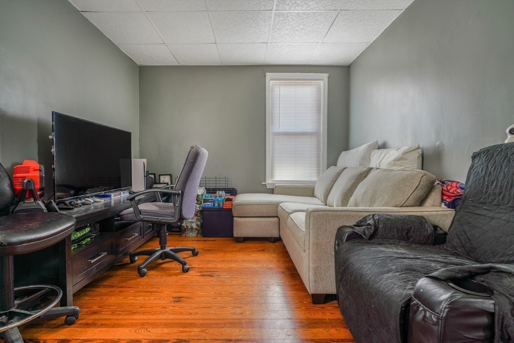 500 Birch Street Fall River, MA 02724 - Photo 15 of 35 a living room with furniture and a flat screen tv