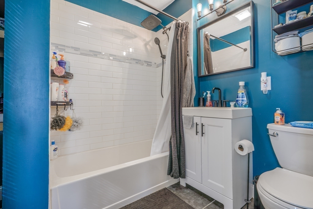 500 Birch Street Fall River, MA 02724 - Photo 18 of 35 a bathroom with a sink a toilet and shower