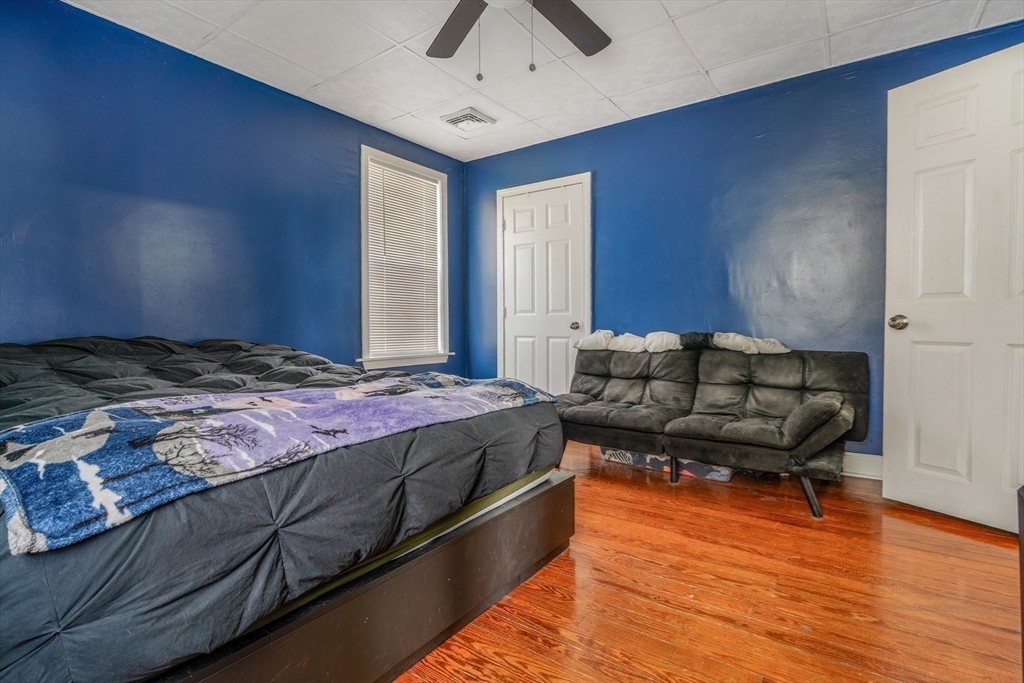 500 Birch Street Fall River, MA 02724 - Photo 19 of 35 a spacious bedroom with a bed and wooden floor