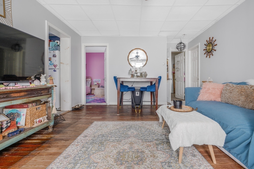 500 Birch Street Fall River, MA 02724 - Photo 27 of 35 a living room with furniture a flat screen tv and a fireplace