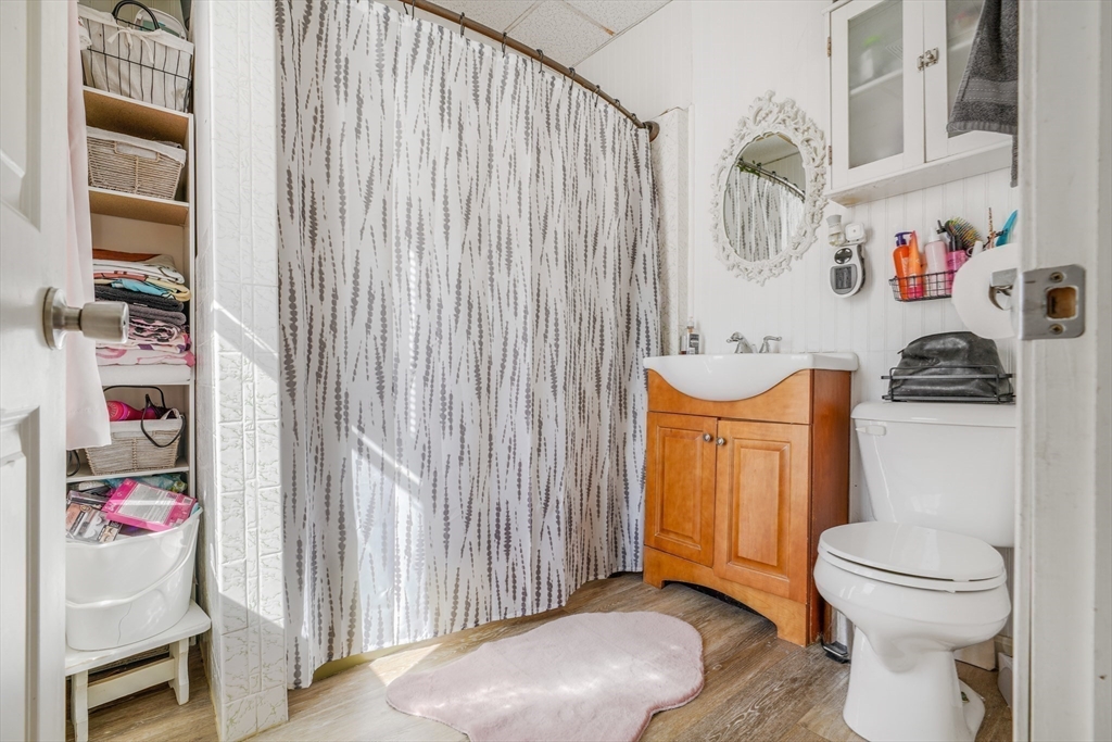 500 Birch Street Fall River, MA 02724 - Photo 30 of 35 a bathroom with a toilet and a shower curtain