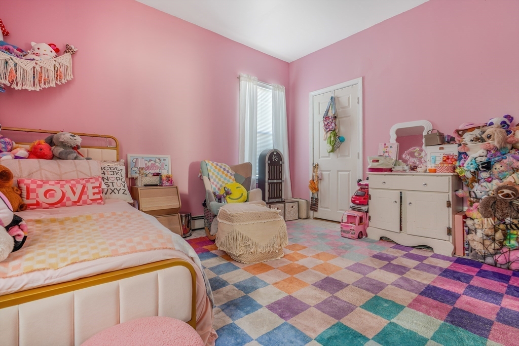 500 Birch Street Fall River, MA 02724 - Photo 31 of 35 a bedroom with a bed and a dresser in it