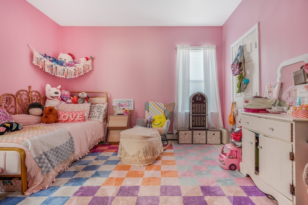 500 Birch Street Fall River, MA 02724 - Photo 32 of 35 a bedroom with a bed and a lamp