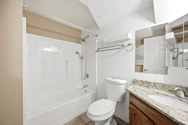 734 Sandy Dunes Drive Sandy, UT 84094 - Photo 26 of 36 Basement Bathroom featuring upgraded shower head & granite countertops