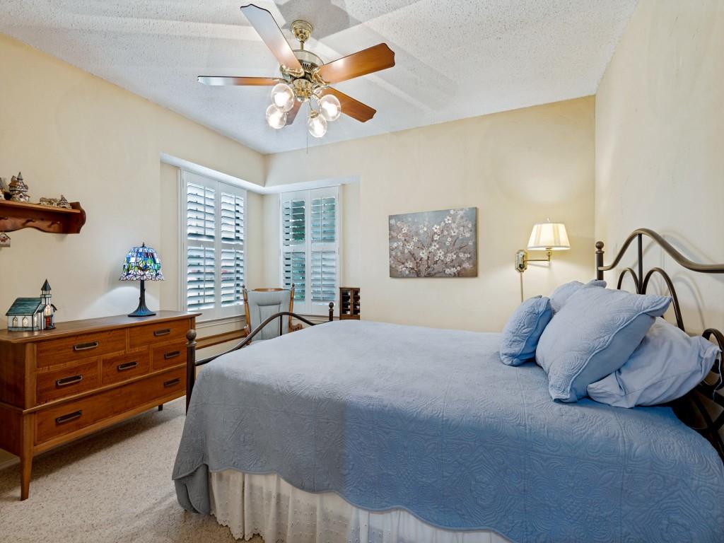 2213 Ridgewood Bedford, TX 76021 - Photo 24 of 40 Spacious bedroom with corner window seat and walk-in closet.