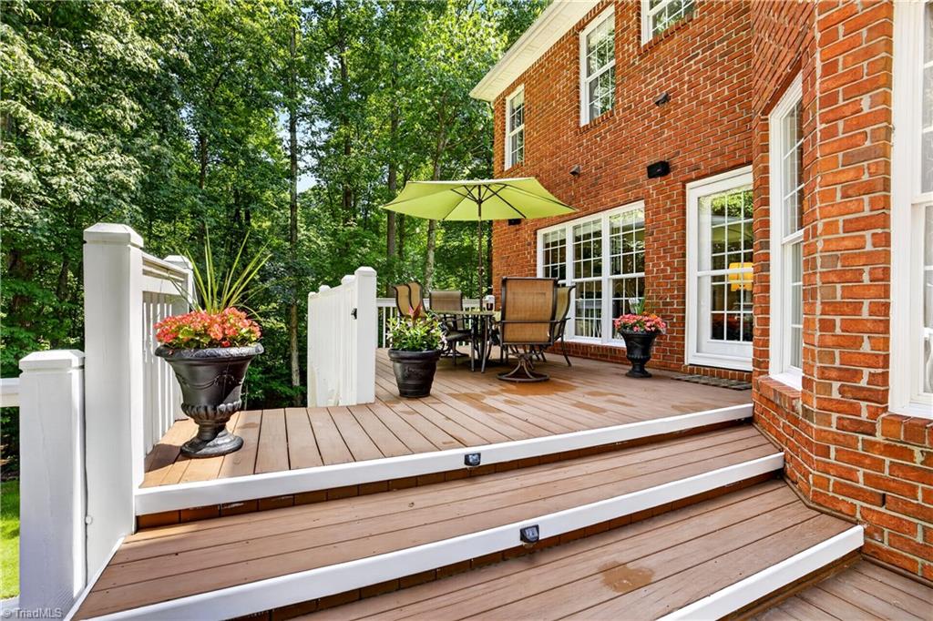 8508 Rosedale Drive Oak Ridge, NC 27310 - Photo 43 of 50 Al fresco dinners with the woods as your backdrop.