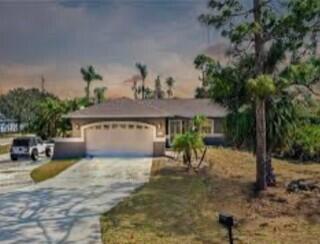 18239 Useppa Road Fort Myers, FL 33967 - Photo 1 of 1 a view of a house with backyard and sitting area