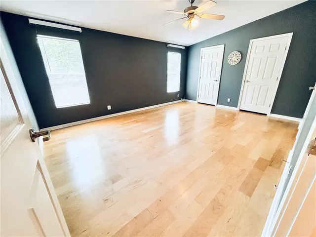a view of a hallway with a window