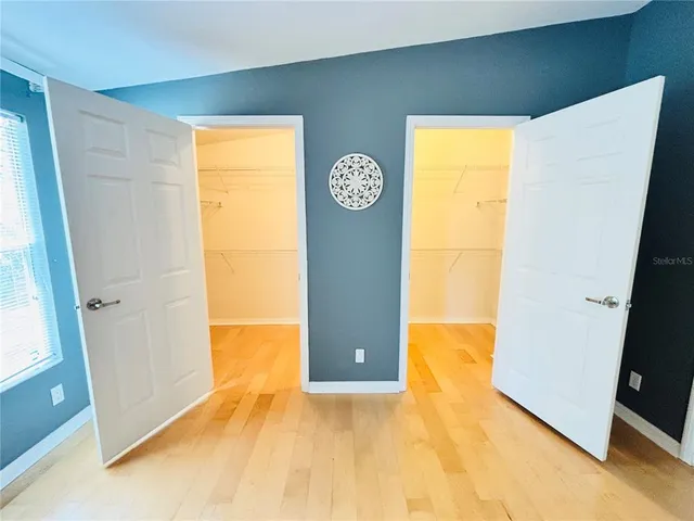 a view of a big room with windows