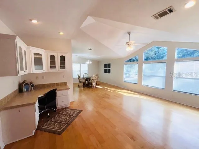 a living room with furniture flat screen tv and a fireplace