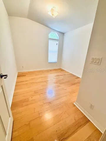 a view of balcony with wooden floor