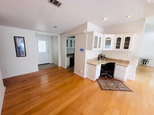 a bedroom with a bed and a chair