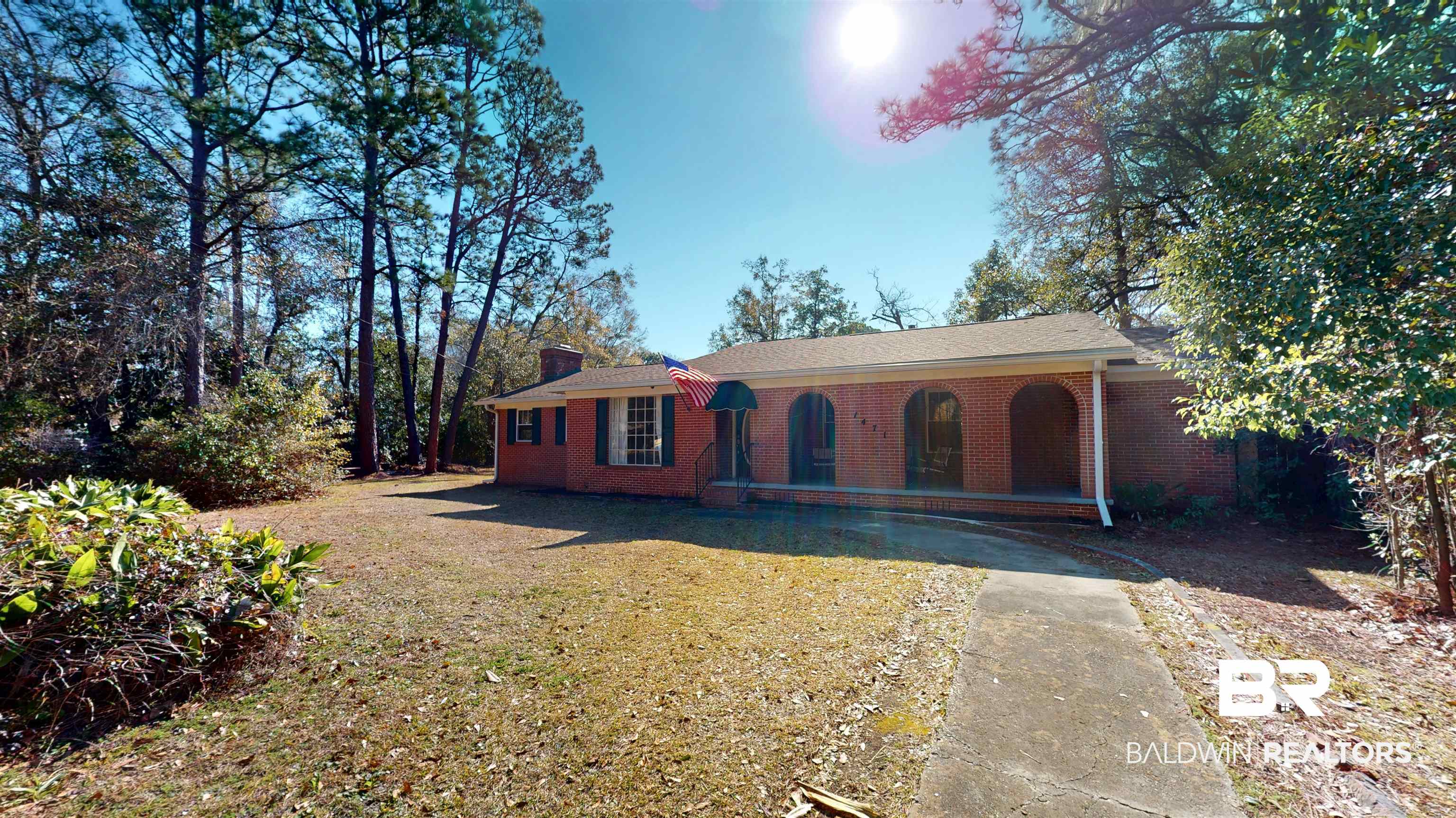 1471 Cedar Crescent Drive Mobile, AL 36605 - Photo 3 of 28 View of front of house with brick siding, a chimney, and a front yard