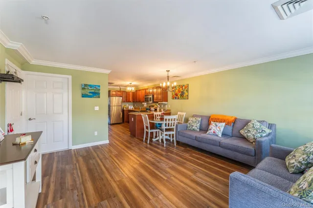 a kitchen with stainless steel appliances granite countertop a refrigerator stove top oven a sink and dishwasher