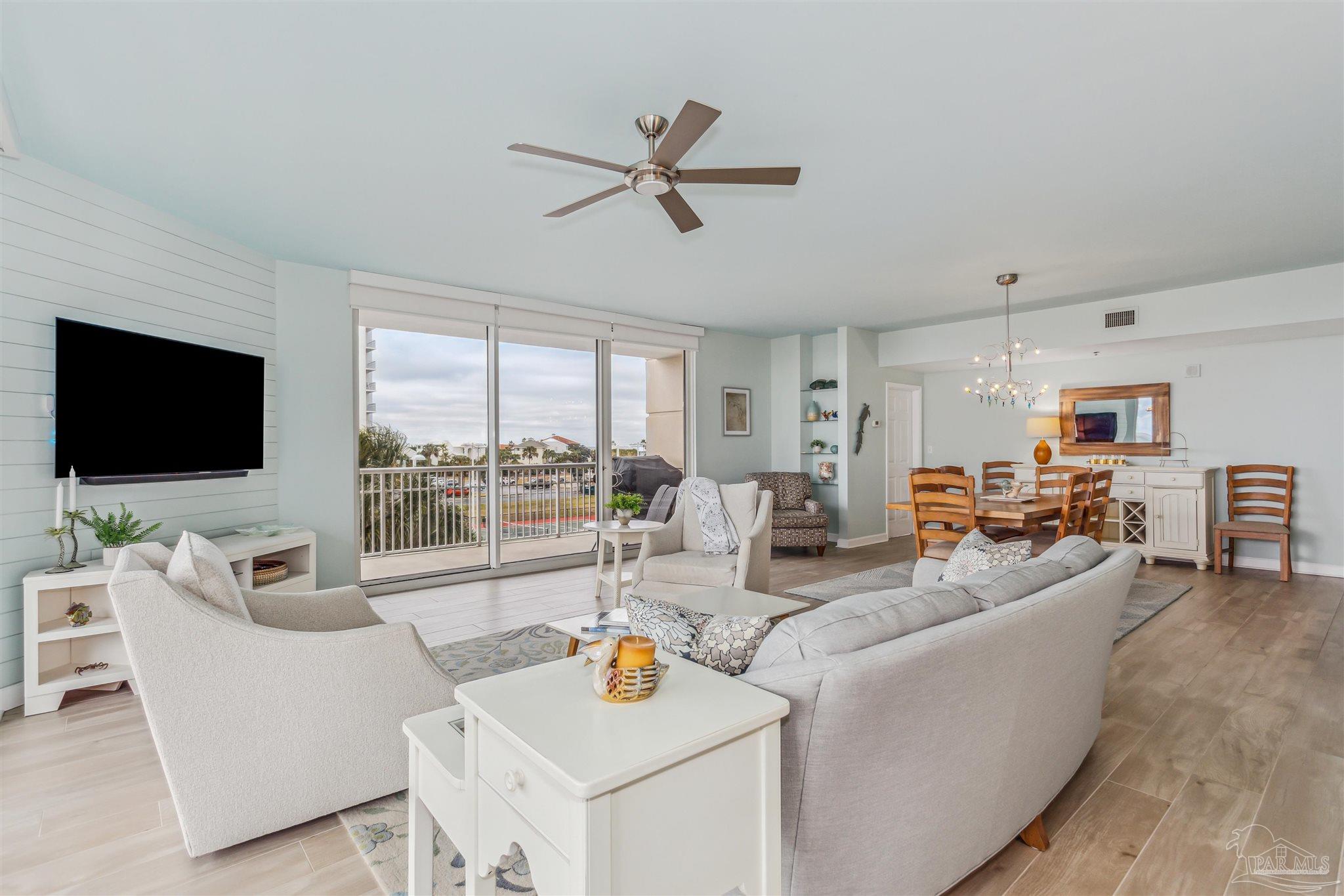 800 Fort Pickens Road, Unit 204 Pensacola Beach, FL 32561 - Photo 10 of 45 a living room with furniture and a flat screen tv
