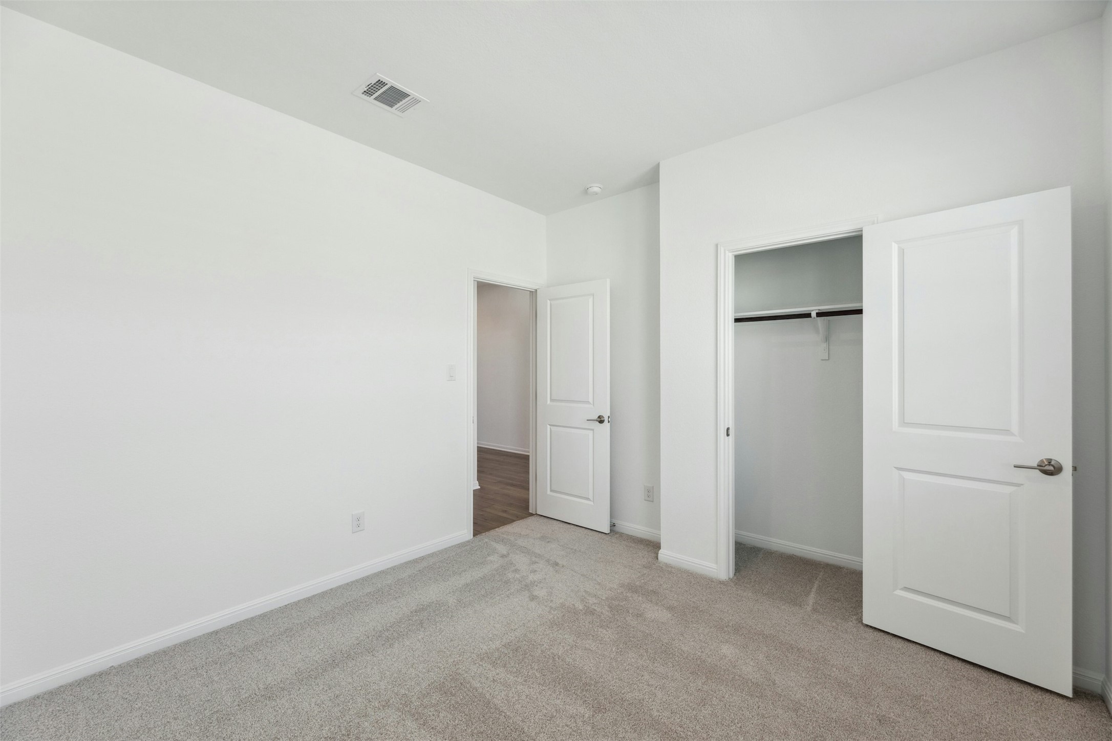 2001 Wynn Road Hutto, TX 78634 - Photo 20 of 39 A spacious, naturally illuminated bedroom offers plush carpeting and ample closet space.