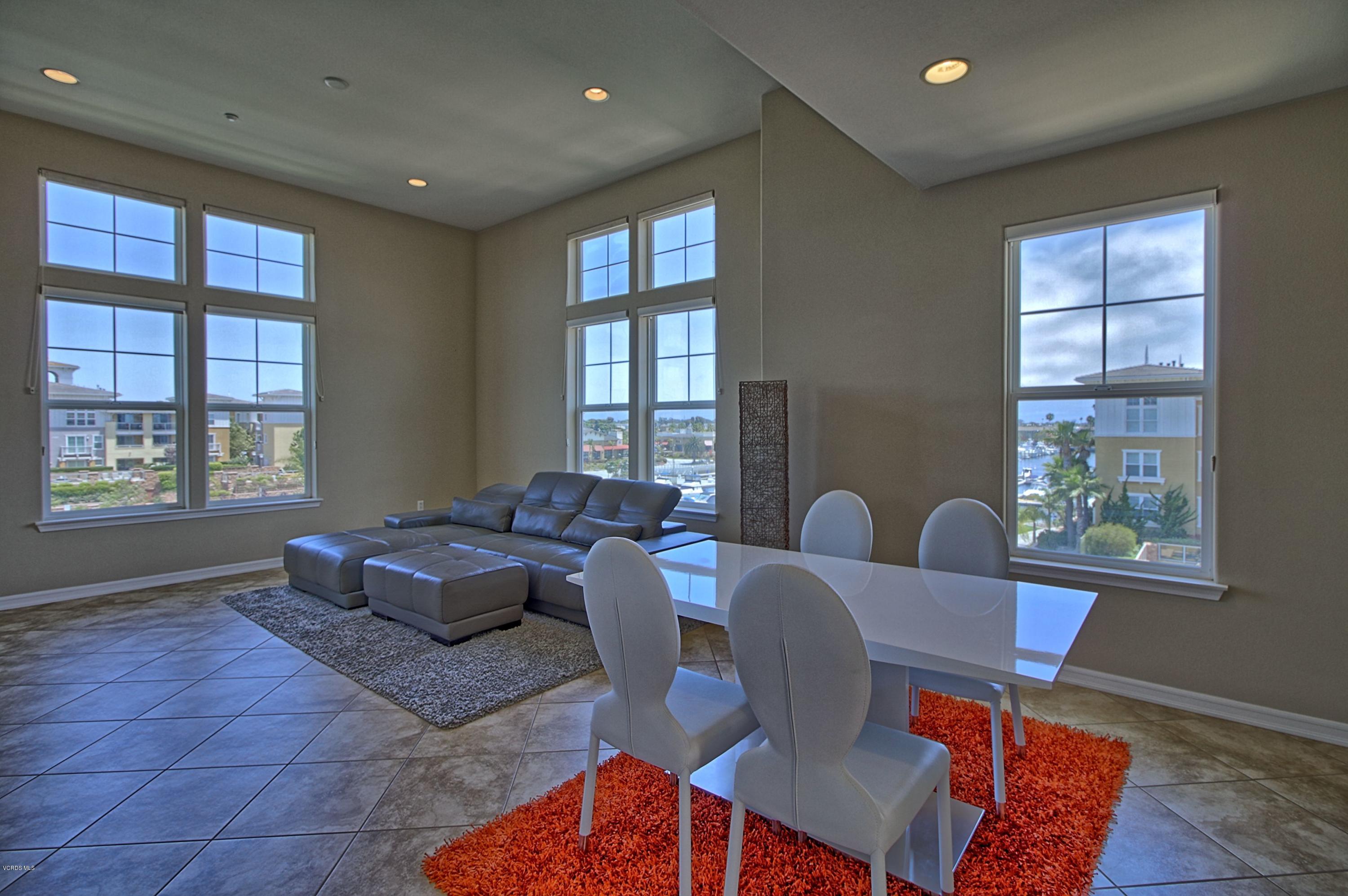 1568 Seabridge Lane Oxnard, CA 93035 - Photo 14 of 33 a living room with furniture and two window