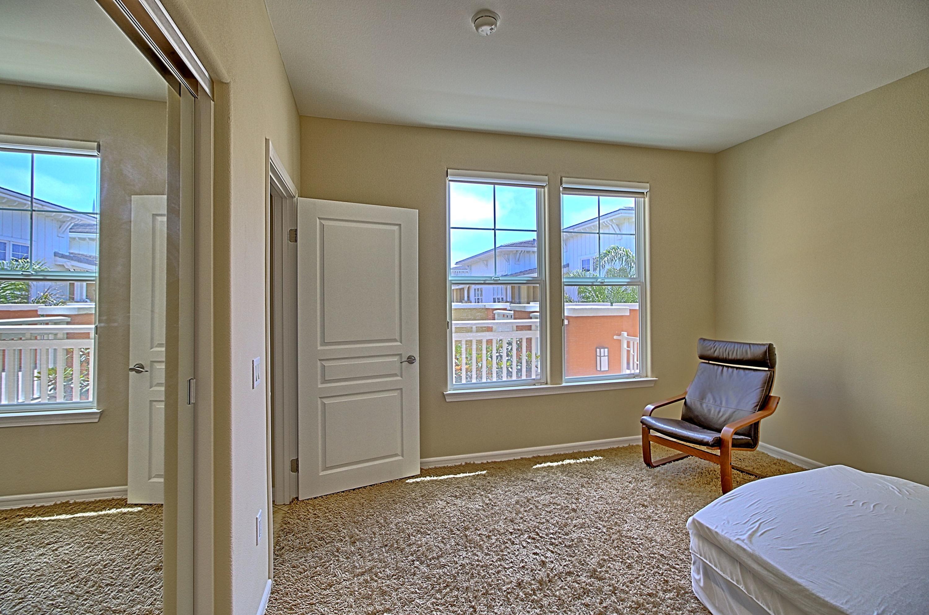 1568 Seabridge Lane Oxnard, CA 93035 - Photo 22 of 33 a living room with furniture and a window