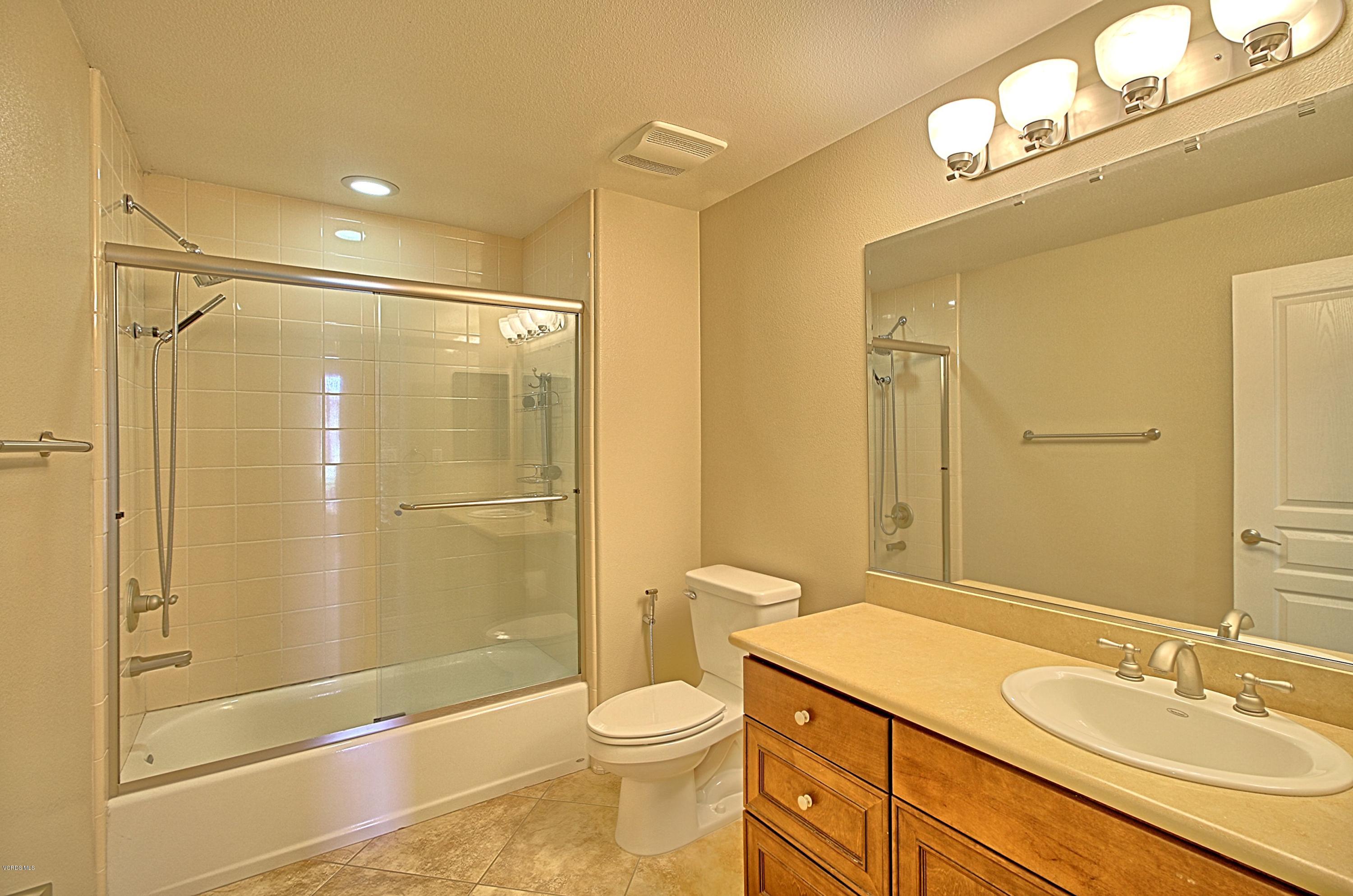 1568 Seabridge Lane Oxnard, CA 93035 - Photo 23 of 33 a bathroom with a sink a toilet and shower