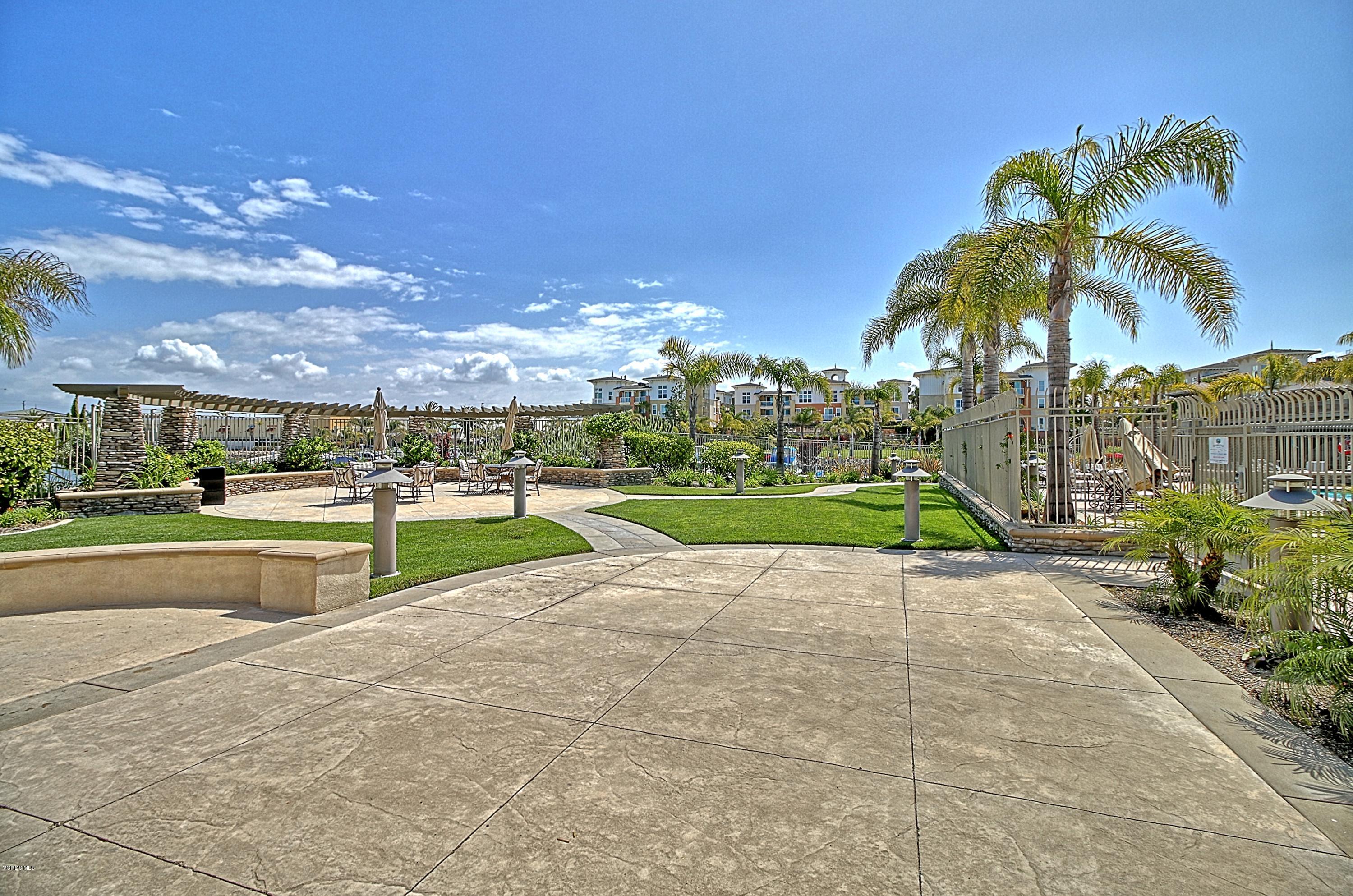 1568 Seabridge Lane Oxnard, CA 93035 - Photo 26 of 33 a view of yard with swimming pool and green space