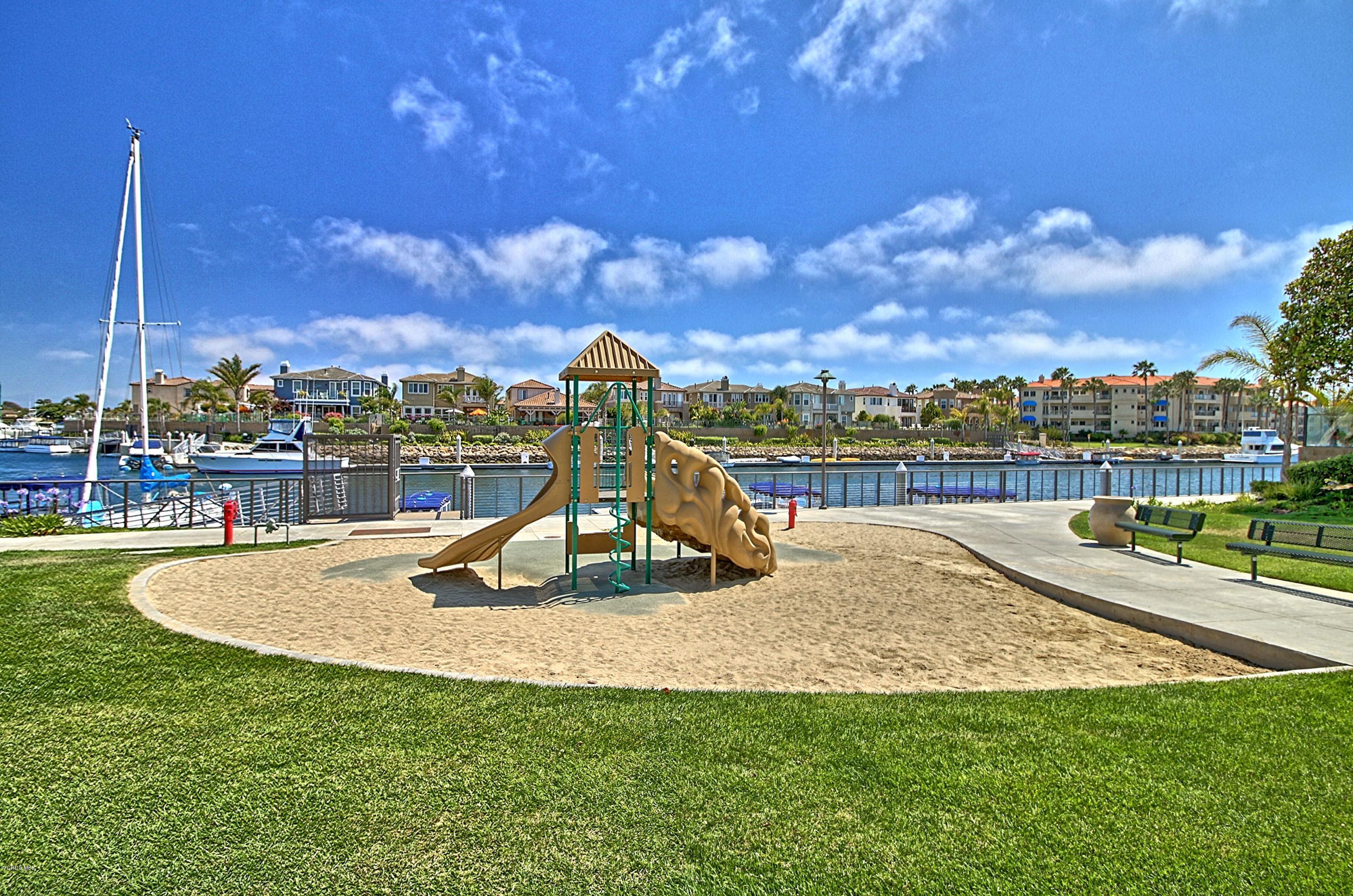 1568 Seabridge Lane Oxnard, CA 93035 - Photo 30 of 33 a view of a swimming pool with a lake view