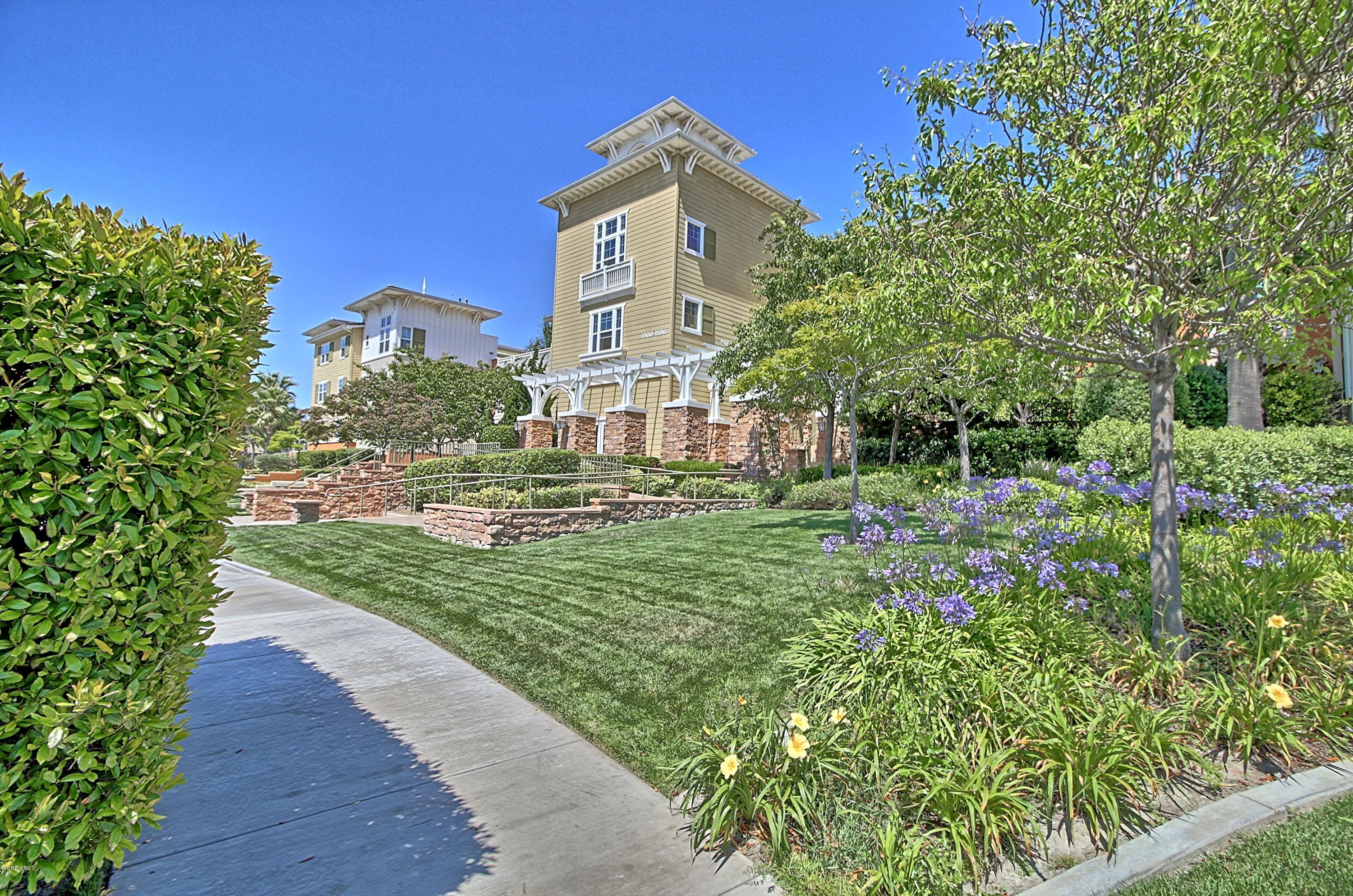 1568 Seabridge Lane Oxnard, CA 93035 - Photo 5 of 33 a front view of a house with a yard
