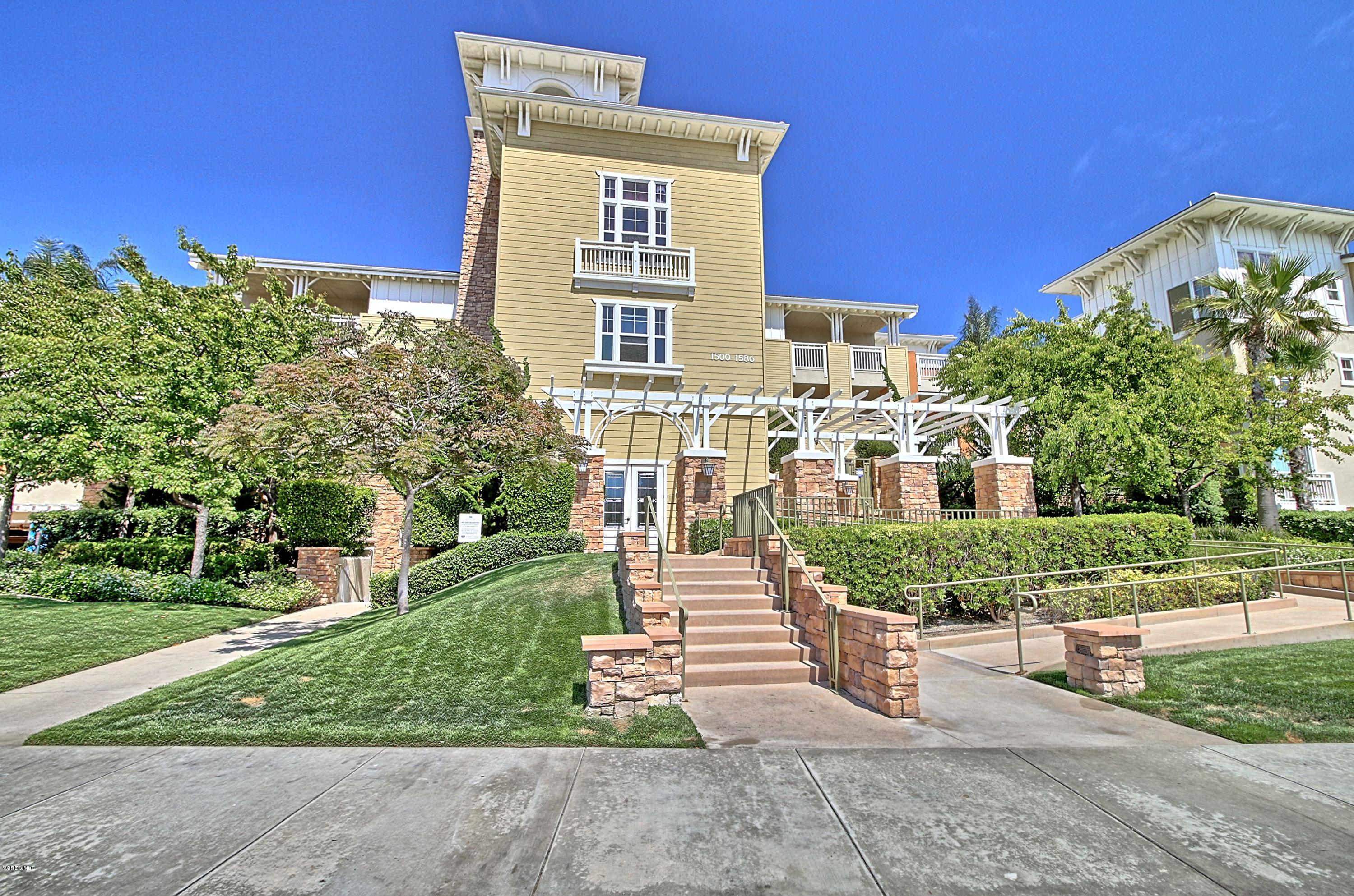 1568 Seabridge Lane Oxnard, CA 93035 - Photo 6 of 33 a front view of a house with a yard
