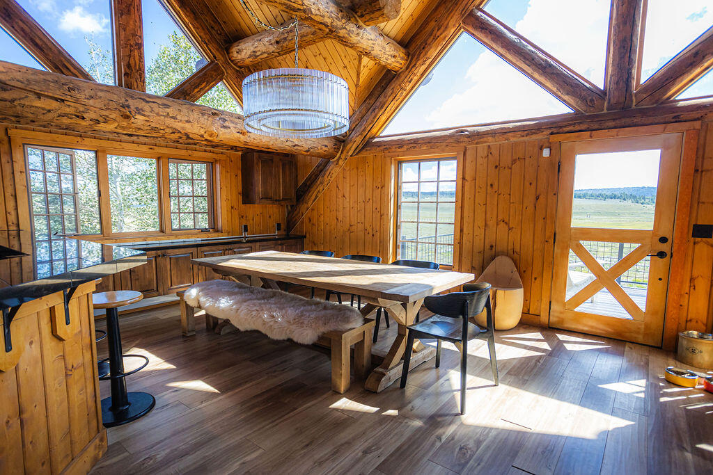 2335 County Road Placerville, CO 81430 - Photo 20 of 38 a dining room with wooden floors and wooden floors
